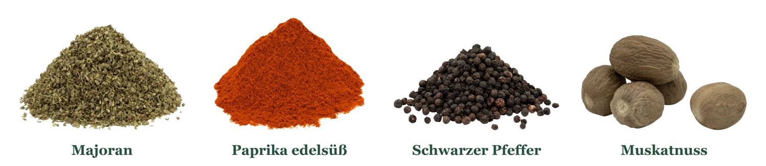 Majoran, Paprika edelsüß, schwarzer Pfeffer und Muskatnüsse als Gewürzhaufen